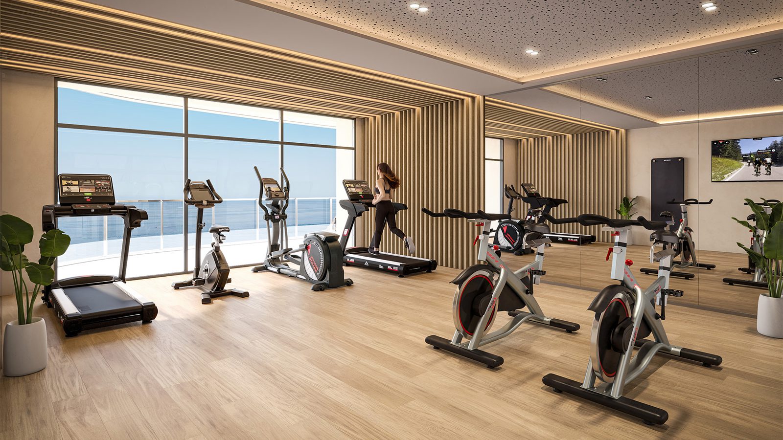 A modern gym with sea views inside a 4-bedroom apartment in Benidorm - The Estates