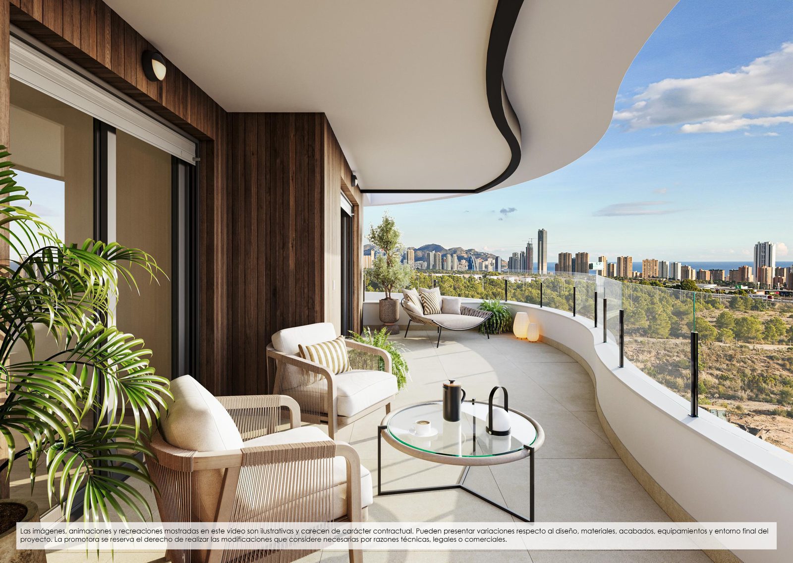 A balcony with seating and views of the town from a 2-bedroom penthouse in Finestrat - The Estates