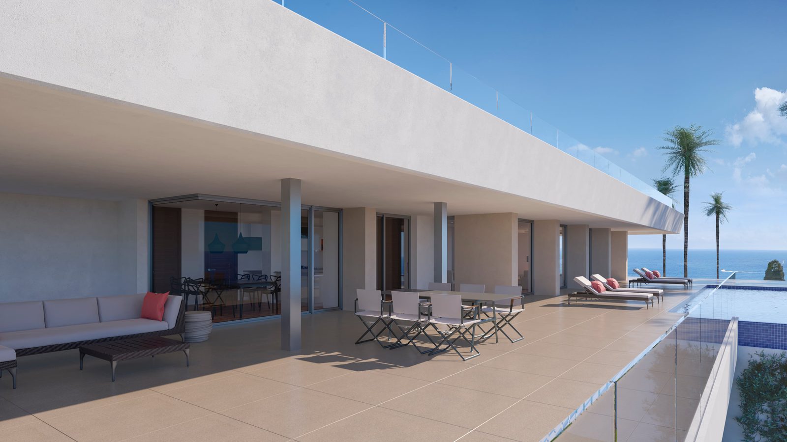 A spacious terrace with seating and a pool overlooking the sea at a 6-bedroom villa in Benitachell - The Estates