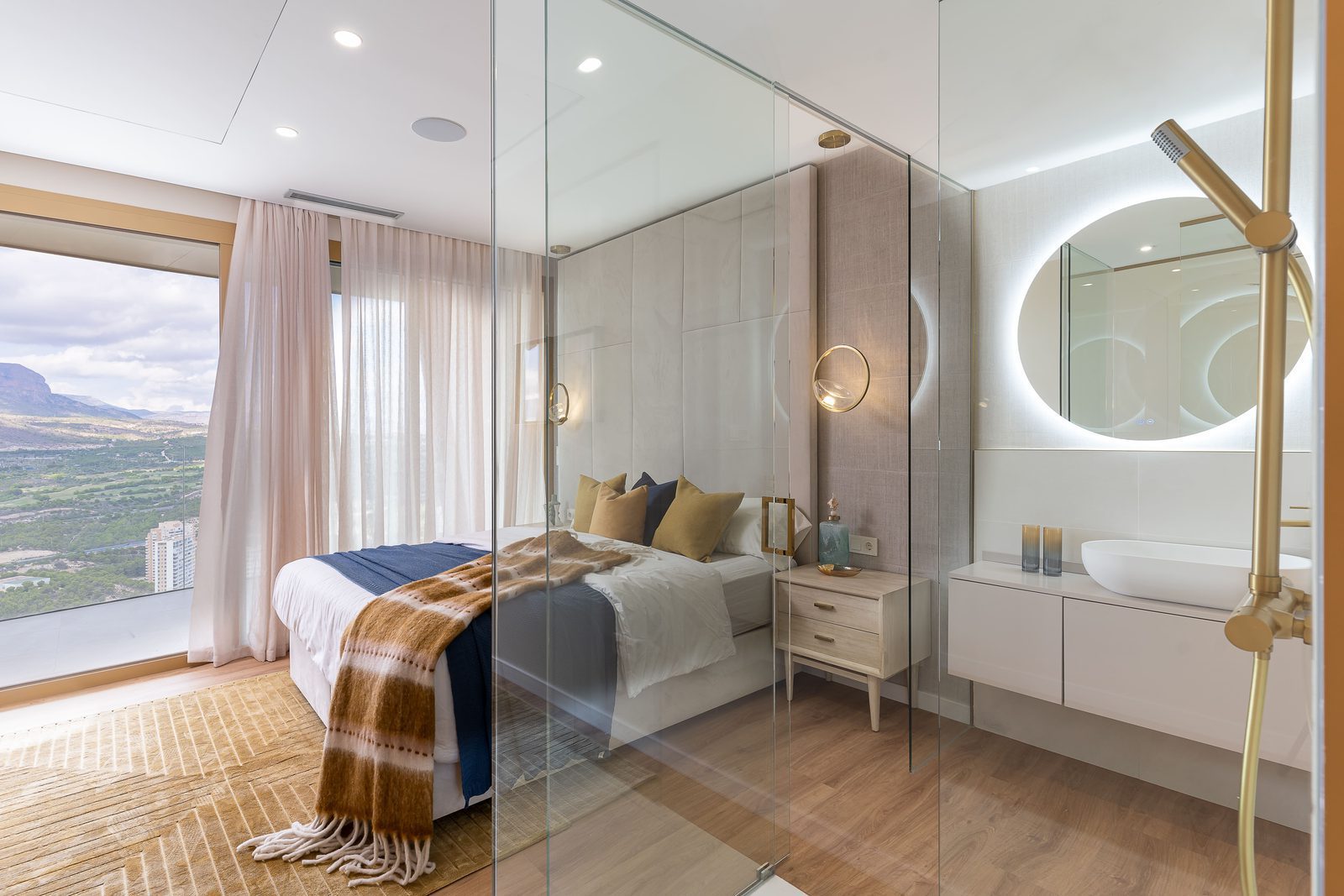 Stylish bedroom with a modern bathroom and stunning sea and mountain views of a 3-bedroom apartment in Benidorm - The Estates