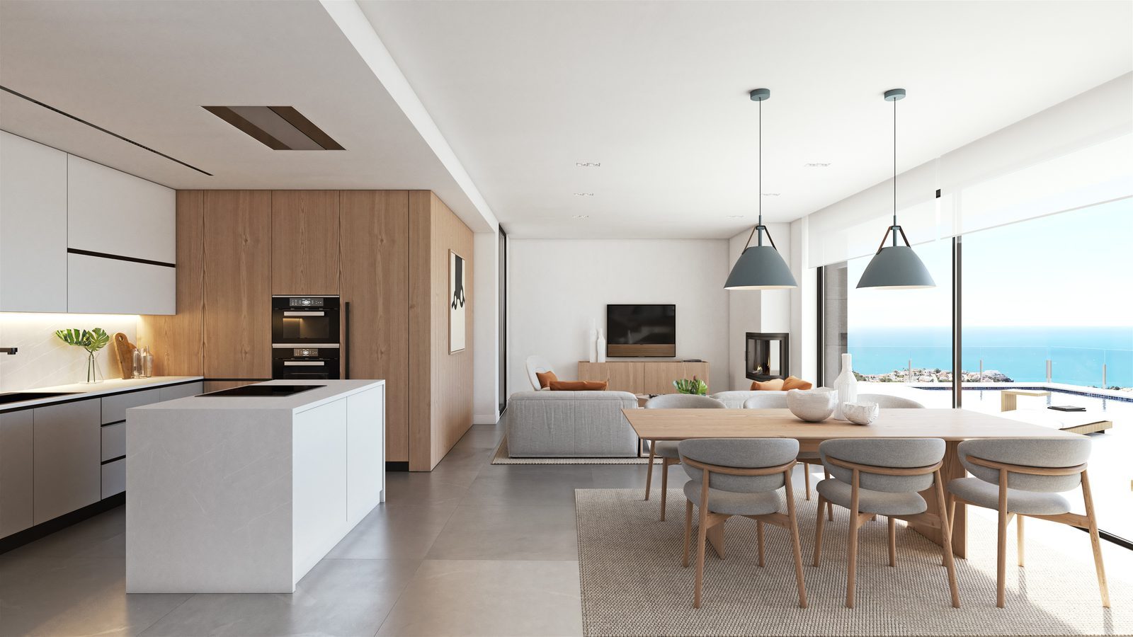 Open-plan kitchen, dining and living area with sea views in a 3-bedroom villa in Benitachell - The Estates