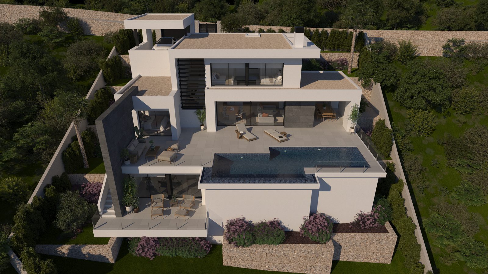 Aerial view of a modern villa with terraces, landscaped gardens and swimming pool in Benitachell - The Estates
