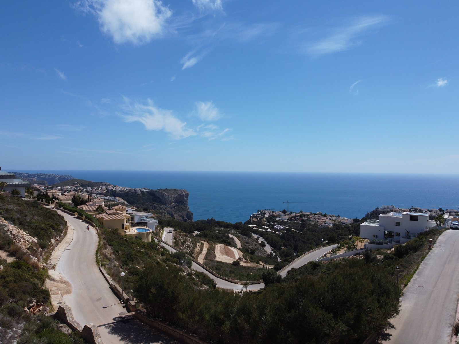 Sea view over coastal villas and rugged cliffs