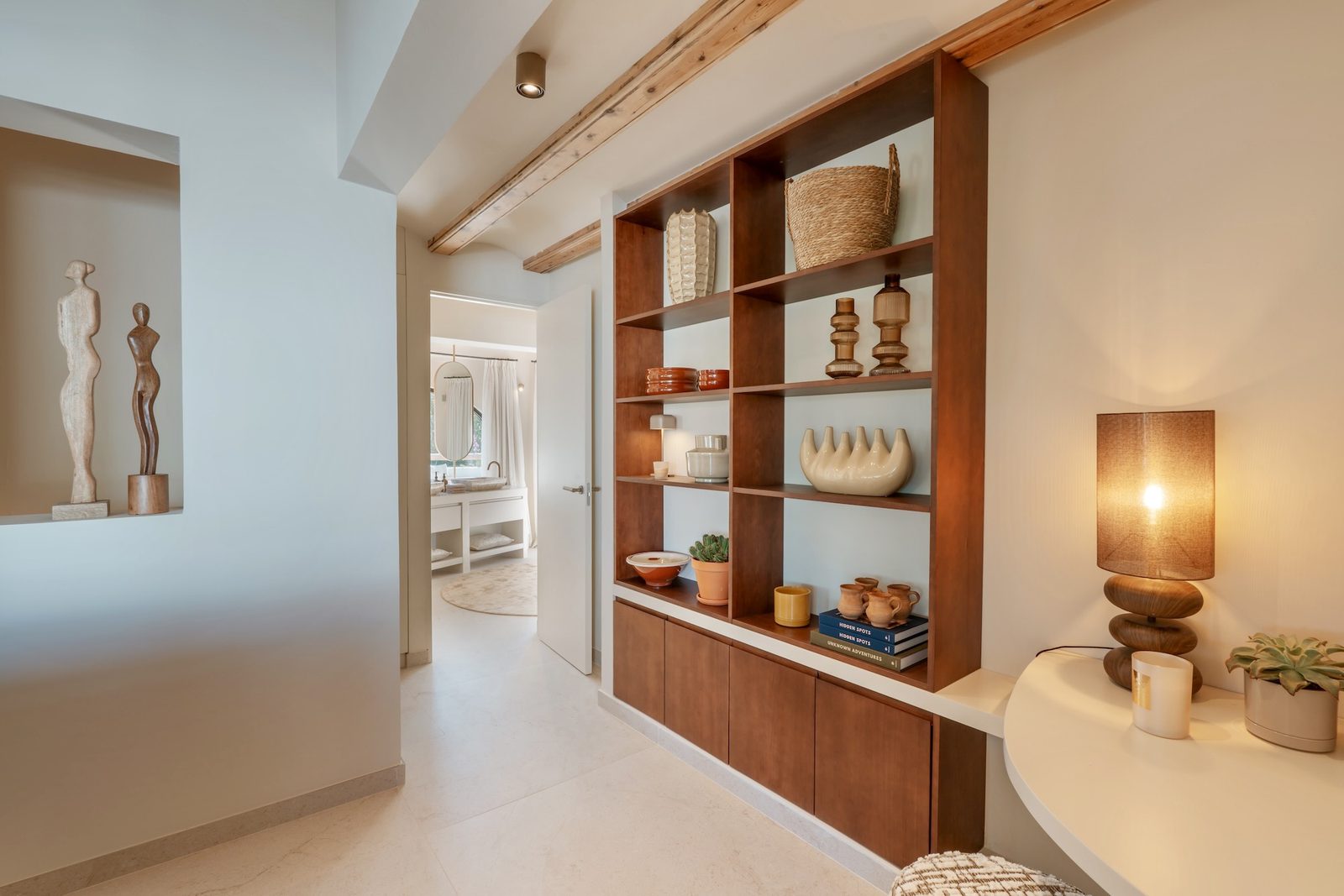 Stylish wooden shelving and a glimpse of a bedroom in a 4-bedroom villa in Javea - The Estates