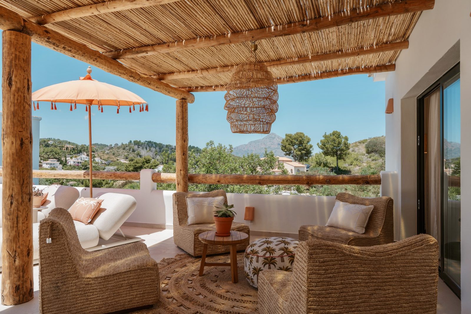 Relaxing outdoor lounge area with mountain and countryside views of a 4-bedroom villa in Javea - The Estates