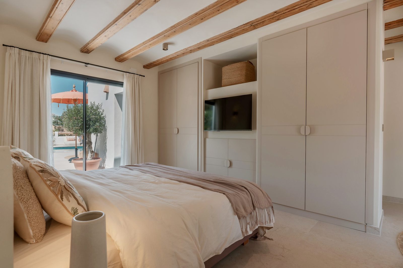 Stylish bedroom with built-in wardrobes and garden views in a 4-bedroom villa in Javea - The Estates