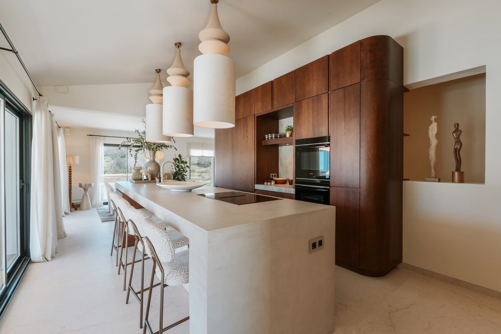Modern kitchen with island seating in a 4-bedroom villa in Javea - The Estates