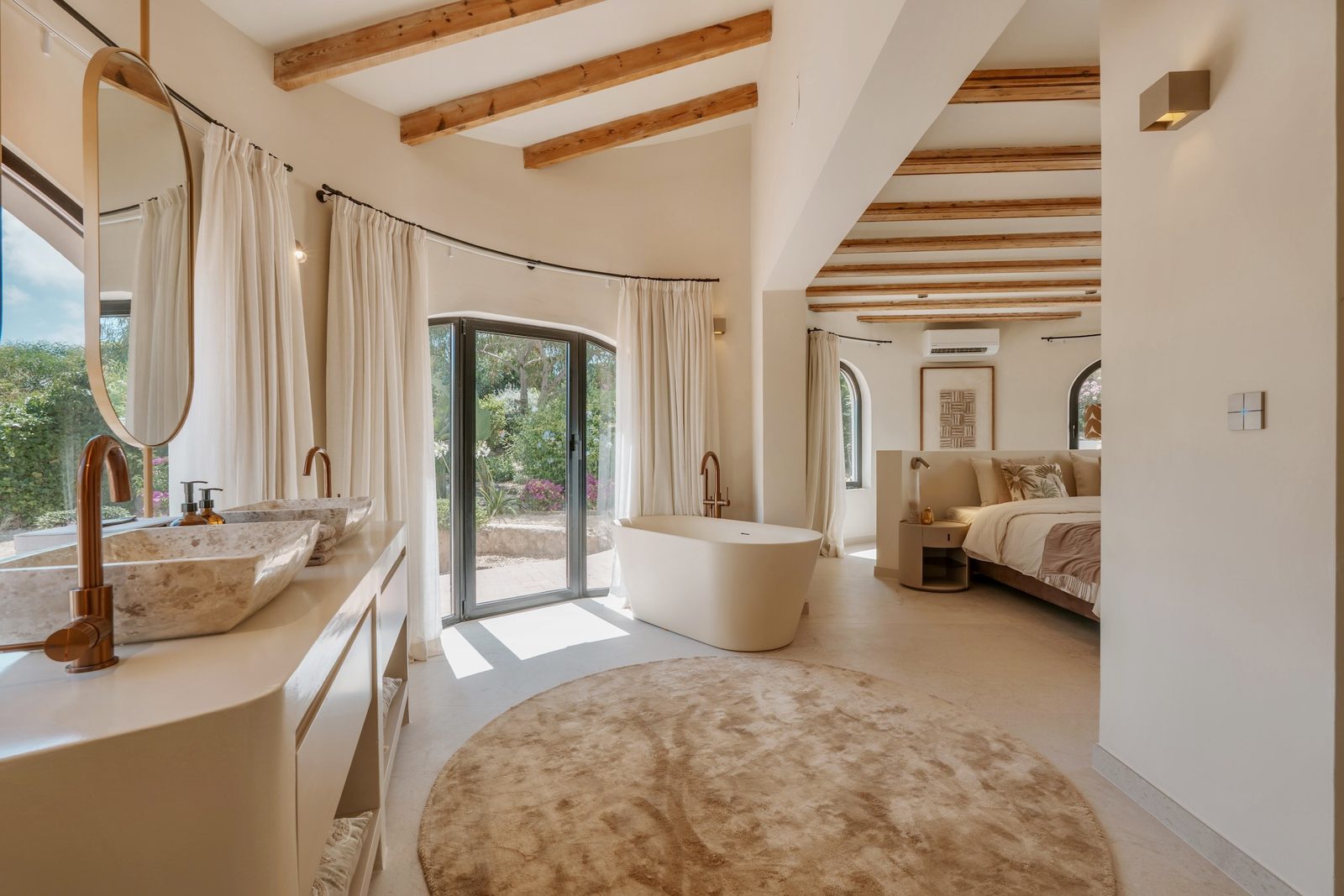 Luxurious bathroom with a freestanding tub and views of the garden in a 4-bedroom villa in Javea - The Estates