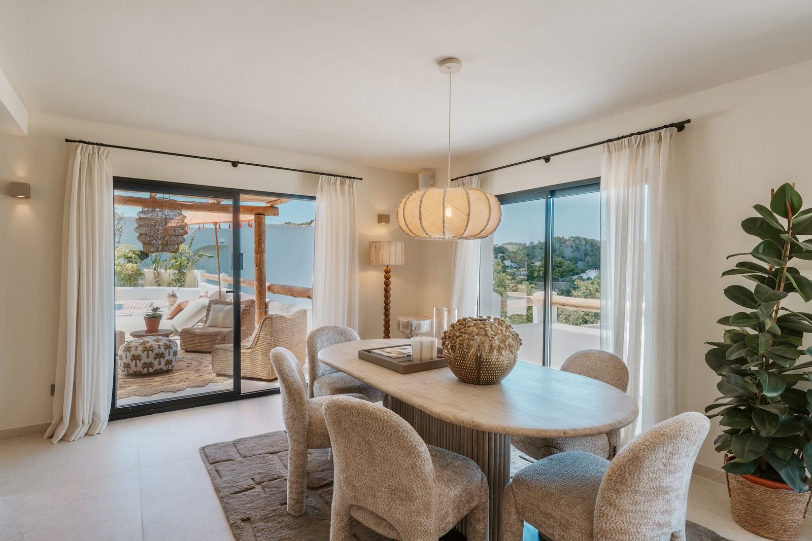 Elegant dining area with garden views inside a 4-bedroom villa in Javea - The Estates