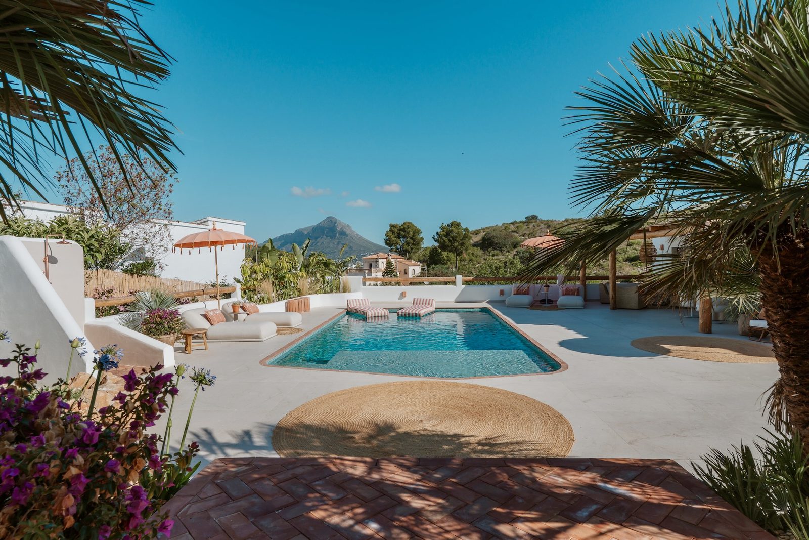 A beautiful pool area with mountain views of a 4-bedroom villa in Javea - The Estates