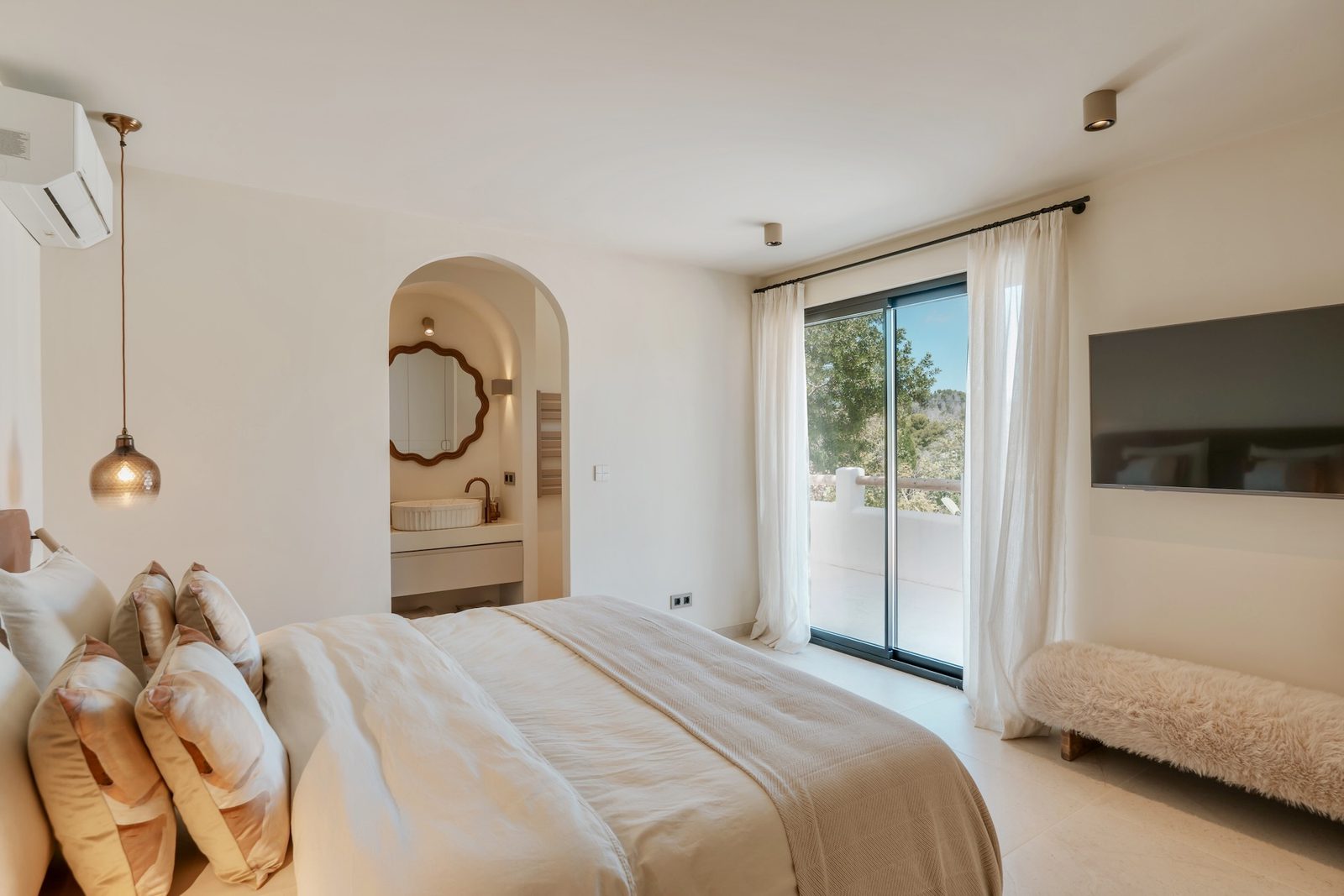 Stylish bedroom with balcony views of a 4-bedroom villa in Javea - The Estates