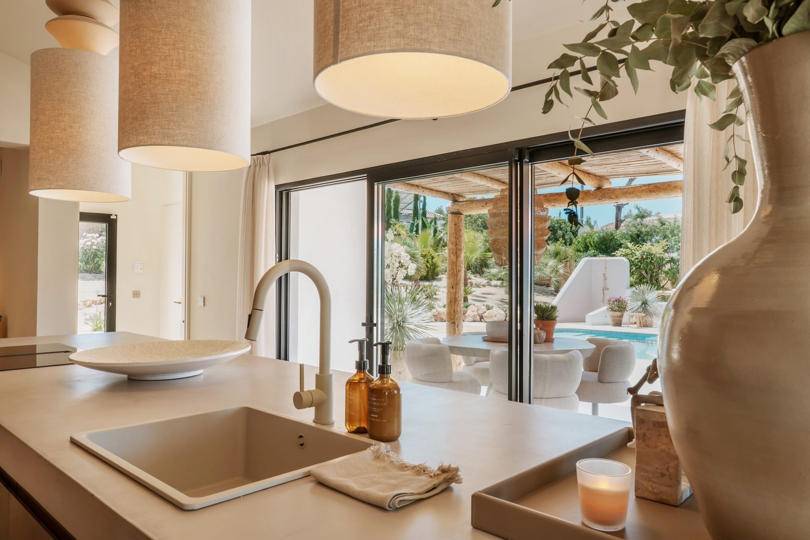 Stylish kitchen with garden and pool views inside a 4-bedroom villa in Javea - The Estates
