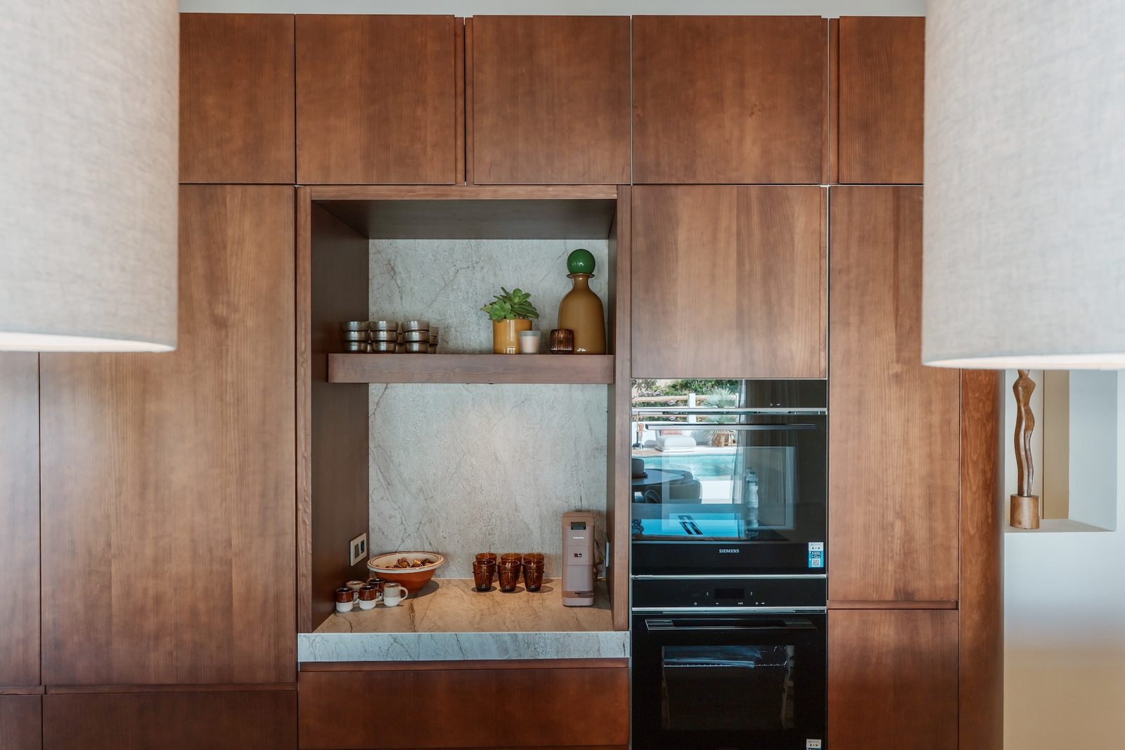 Modern kitchen with built-in appliances and marble accents in a 4-bedroom villa in Javea - The Estates