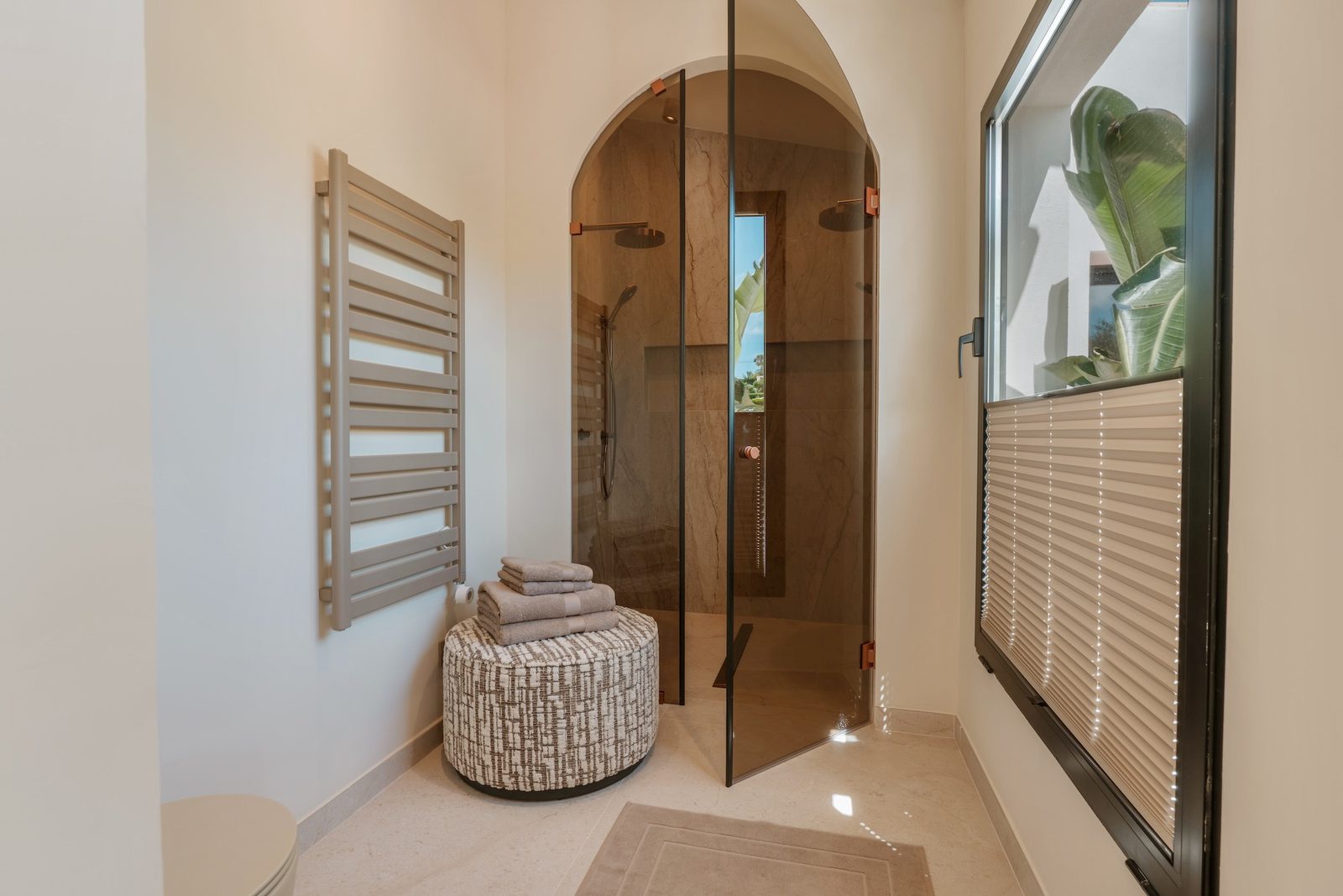 Luxurious bathroom with a walk-in shower and outdoor views of a 4-bedroom villa in Javea - The Estates