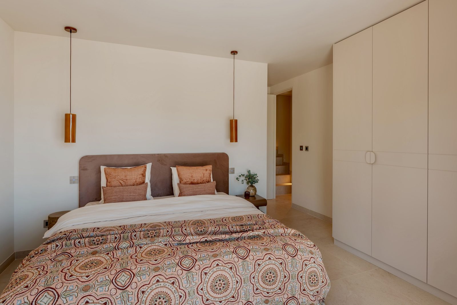 A stylish bedroom with built-in wardrobes in a 4-bedroom villa in Javea - The Estates