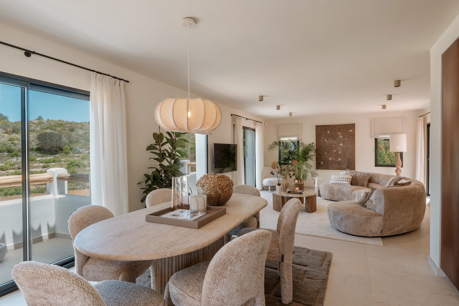 Stylish living and dining area with mountain views in a 4-bedroom villa in Javea - The Estates