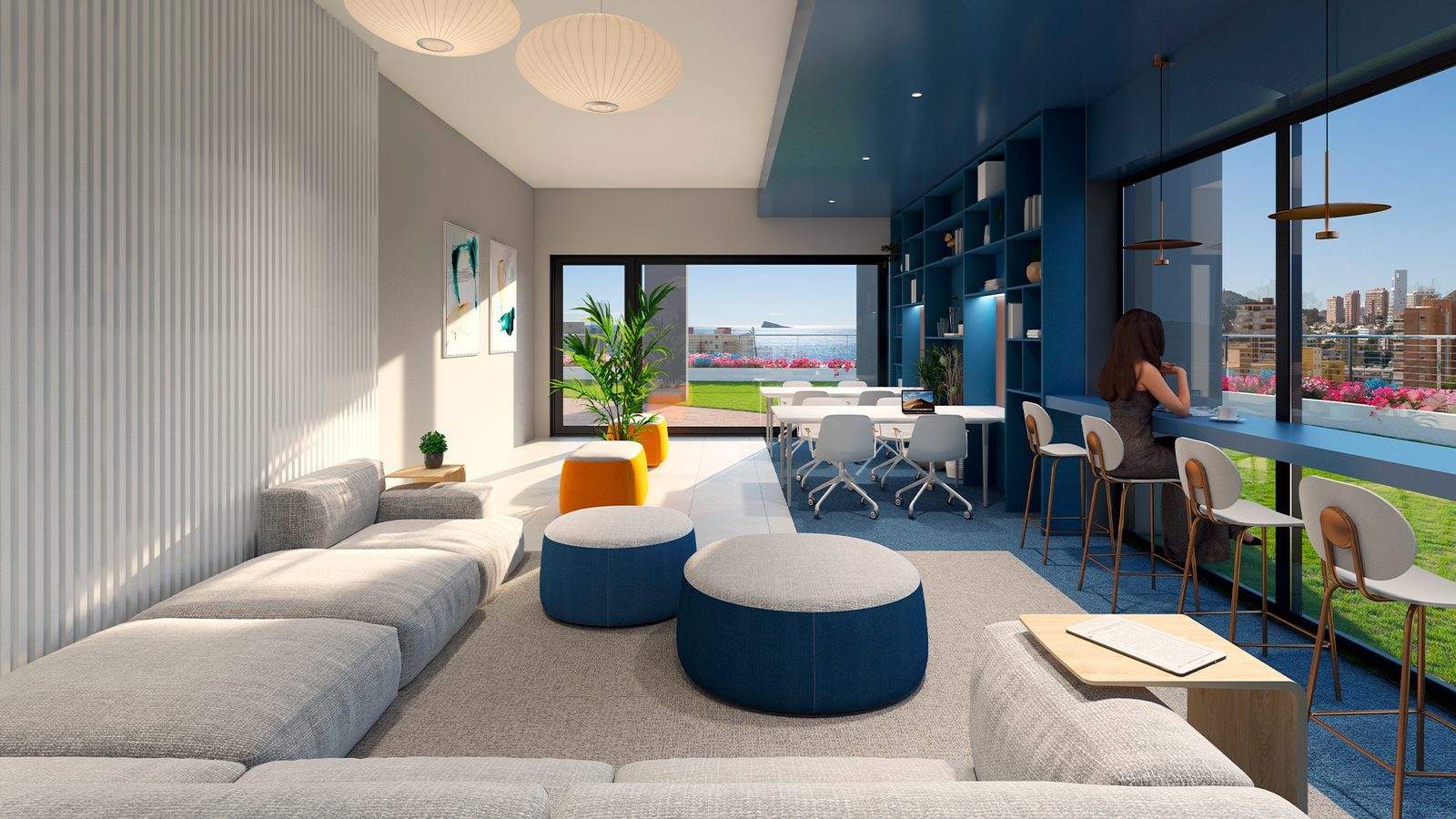 Contemporary lounge and coworking area with panoramic sea views of a 3-bedroom apartment in Benidorm —