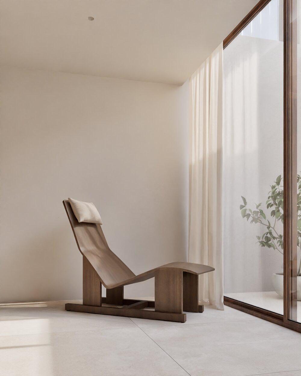 Stylish lounge chair near a window with greenery in a 4-bedroom villa in Denia - The Estates