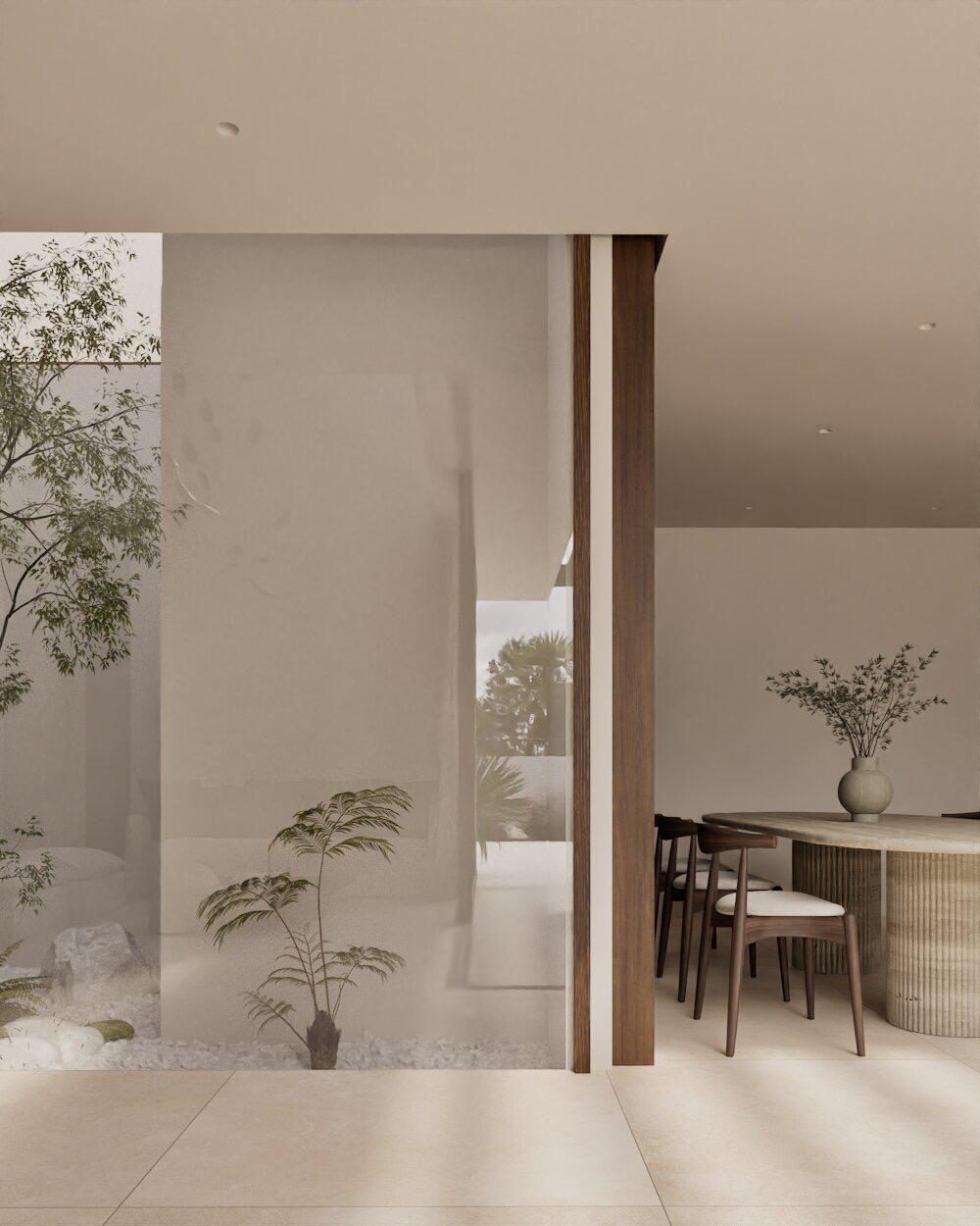 Interior view of a dining area with plants and garden views in a 4-bedroom villa in Denia - The Estates
