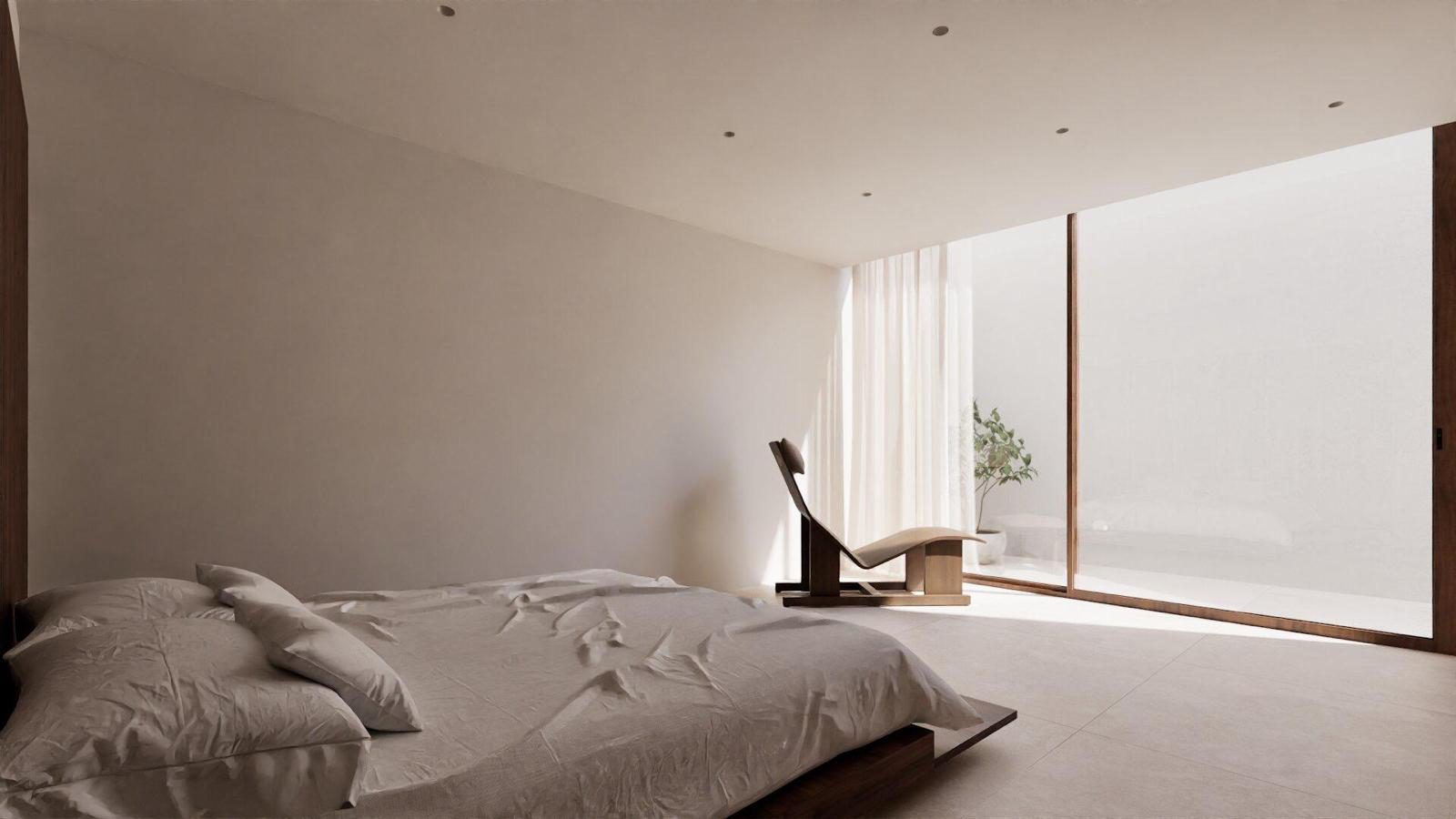 A bright bedroom with a large window and comfortable bed in a 4-bedroom villa in Denia - The Estates