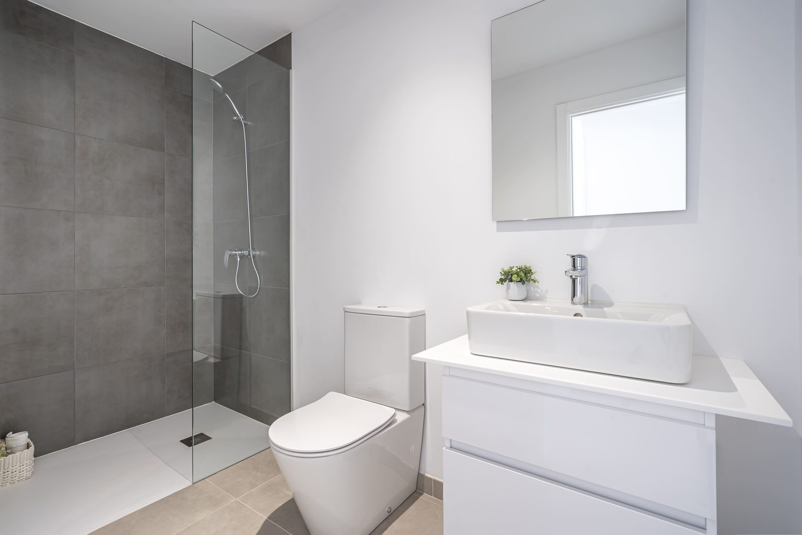A modern bathroom with a walk-in shower and sleek fixtures in a townhouse in Manacor - The Estates