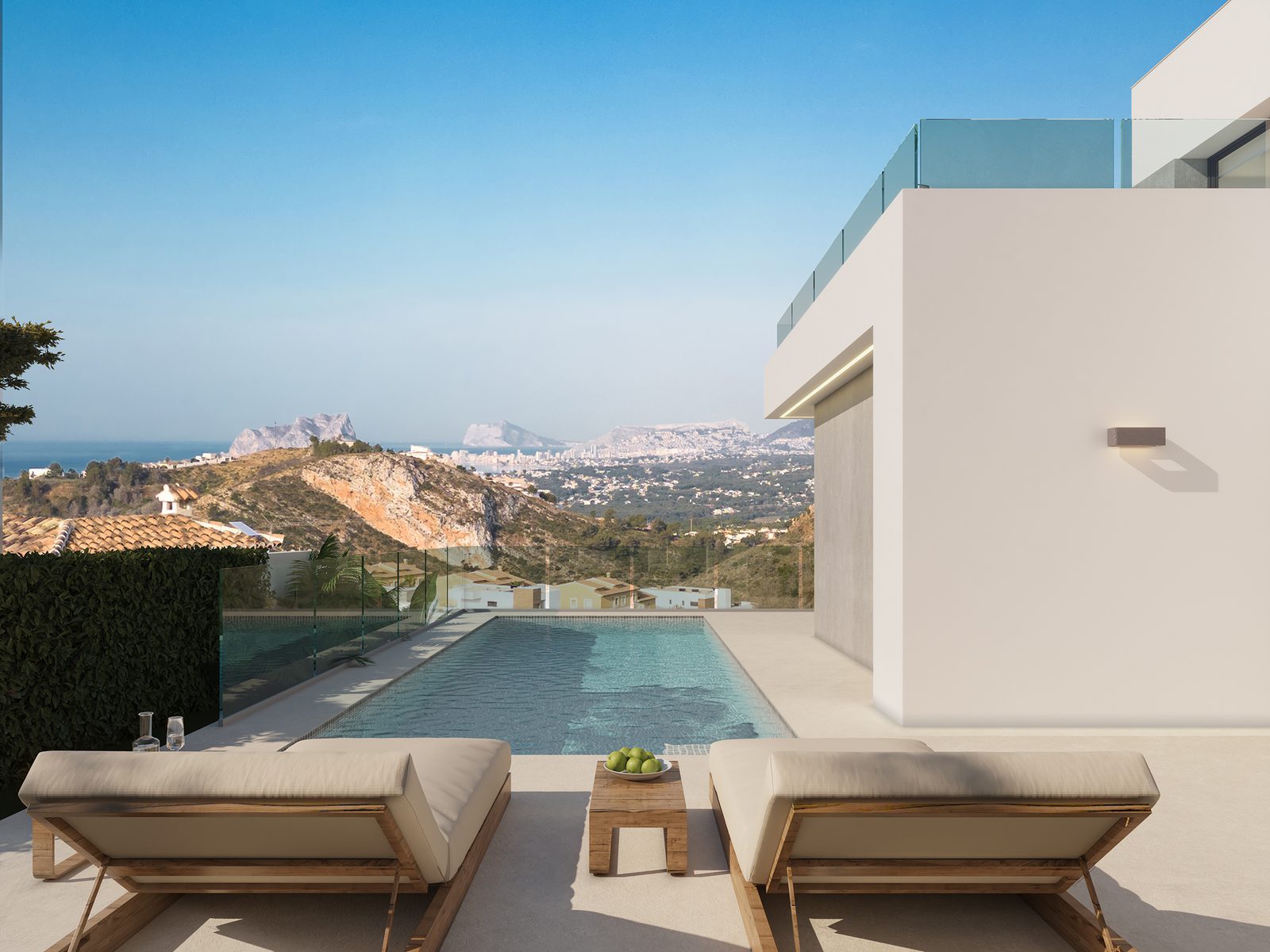 Pool terrace with sun loungers and sea views at a modern villa in Benitachell - The Estates