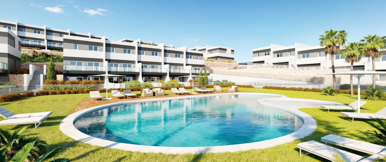 Communal swimming pool and modern residences of a 3-bedroom townhouse in Finestrat - The