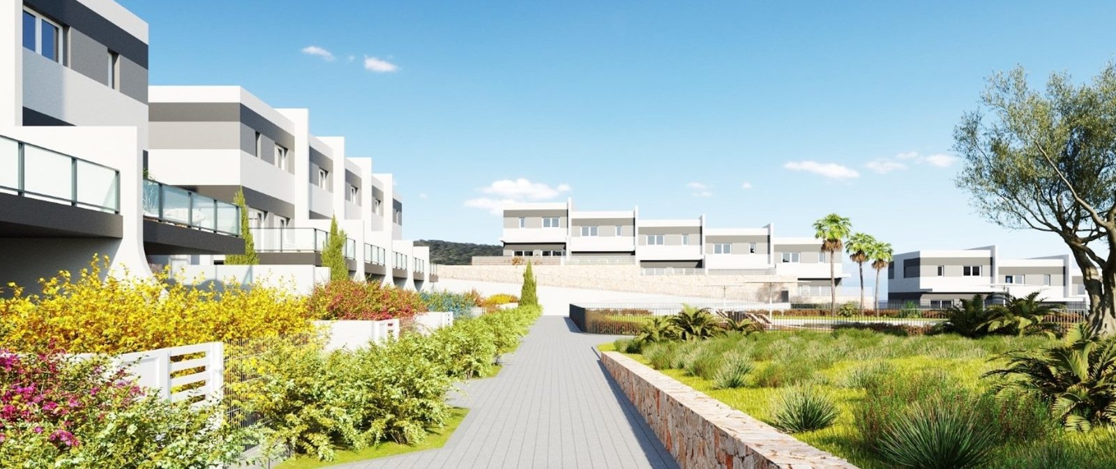 Modern townhouse development with landscaped gardens and communal walkway in Finestrat, a 3-bedroom townhouse in Finestrat - The Estates