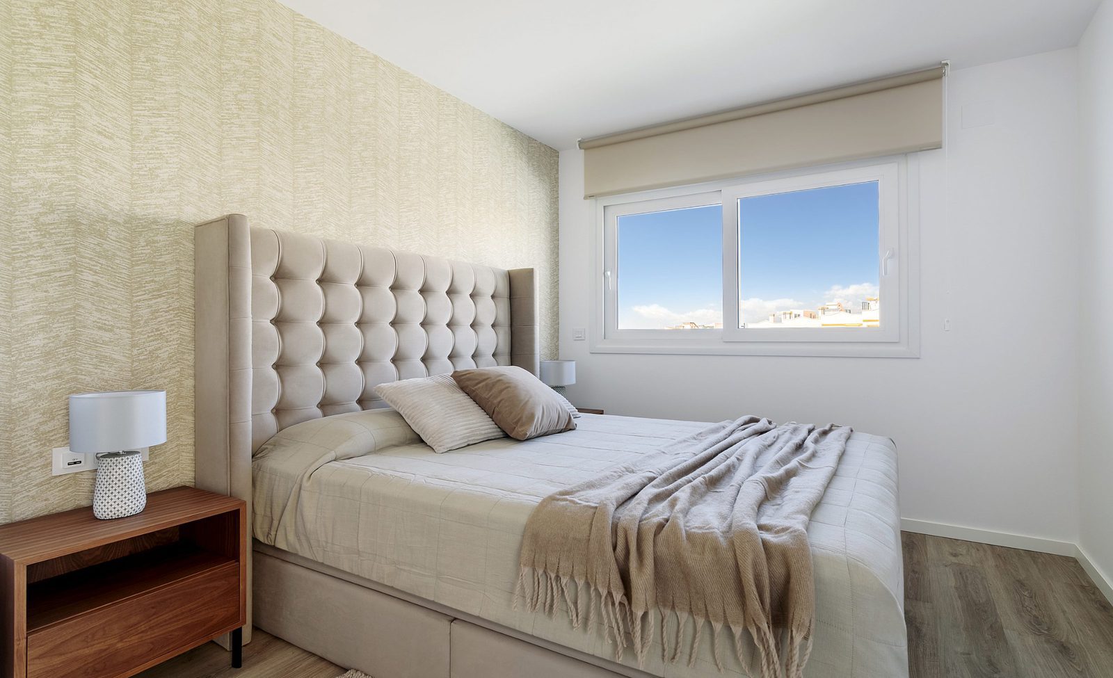 A stylish bedroom with a view of the town from a 4-bedroom villa in Finestrat - The Estates
