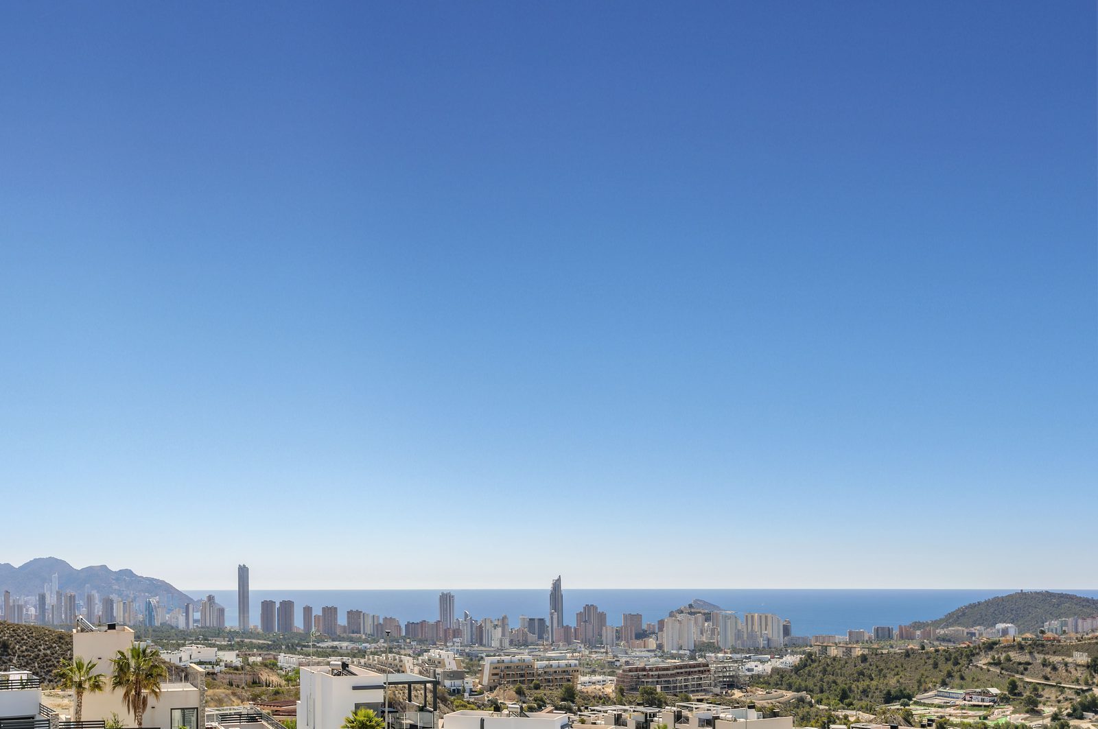 Panoramic views of Benidorm skyline and Mediterranean Sea from the garden of a 4-bedroom villa in