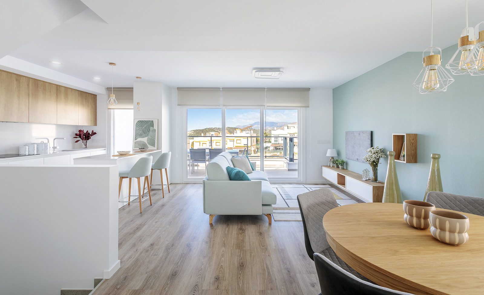Stylish living room and kitchen area with mountain views of a 4-bedroom villa in Finestrat - The Estates