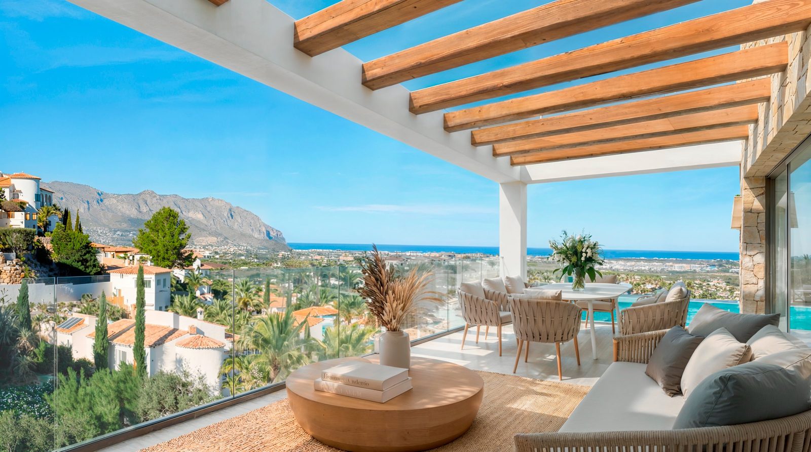 Covered terrace with lounge, dining area and sea views of a 4-bedroom villa in Pedreguer - The Estates