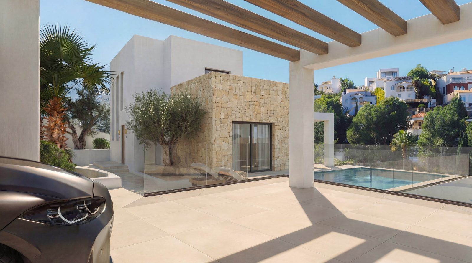 Modern pool terrace with pergola and stone wall of a 4-bedroom villa