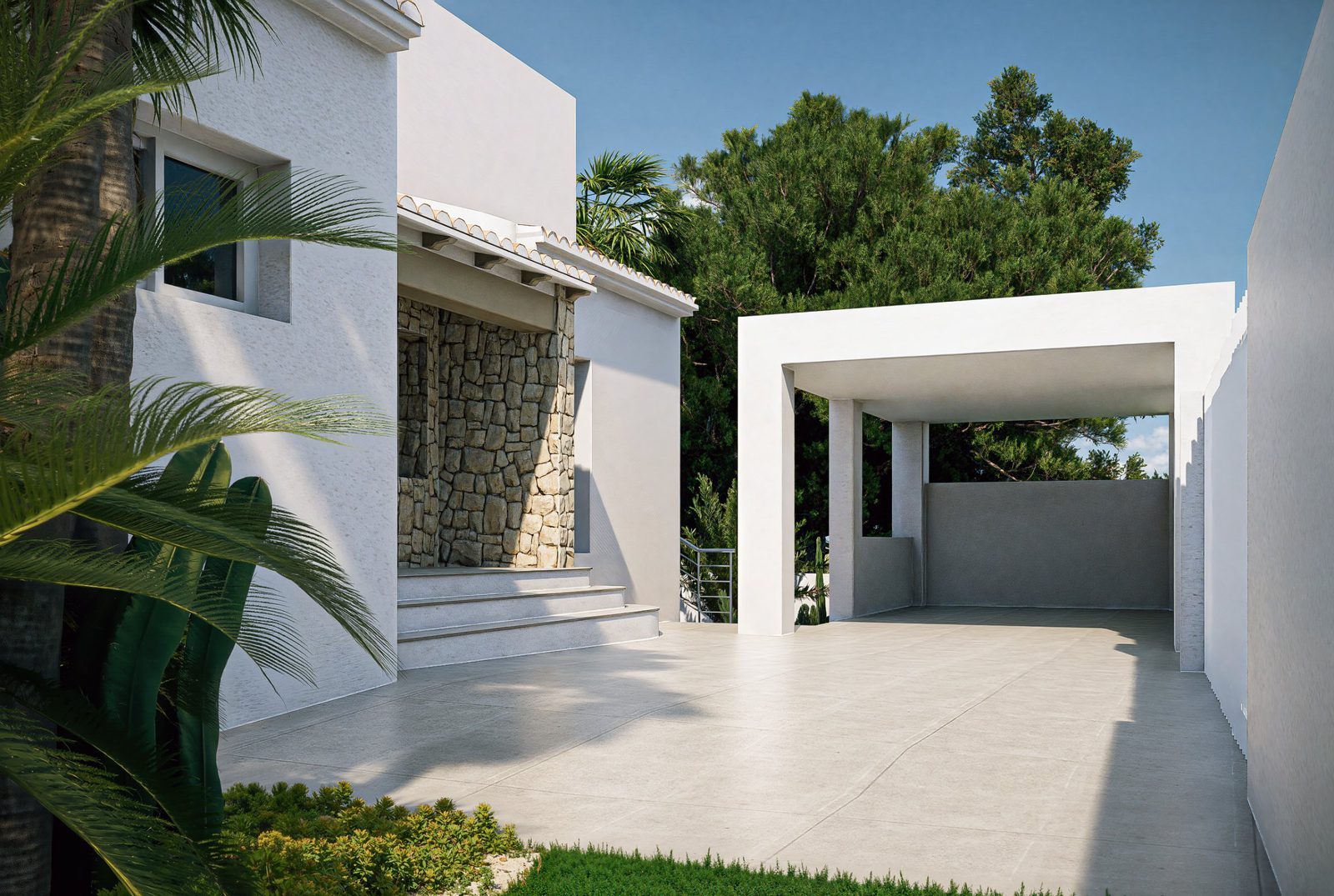 Mediterranean courtyard and covered parking at a white villa with stone walls and palms in Altea - The Estates