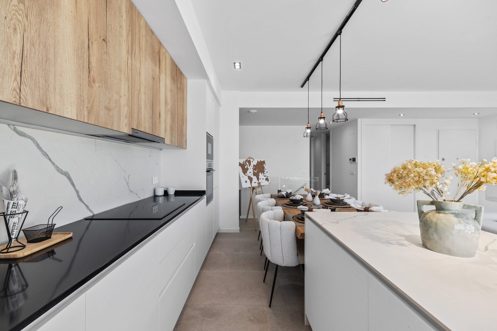 Modern kitchen and dining area of a 2-bedroom apartment in Finestrat - The Estates
