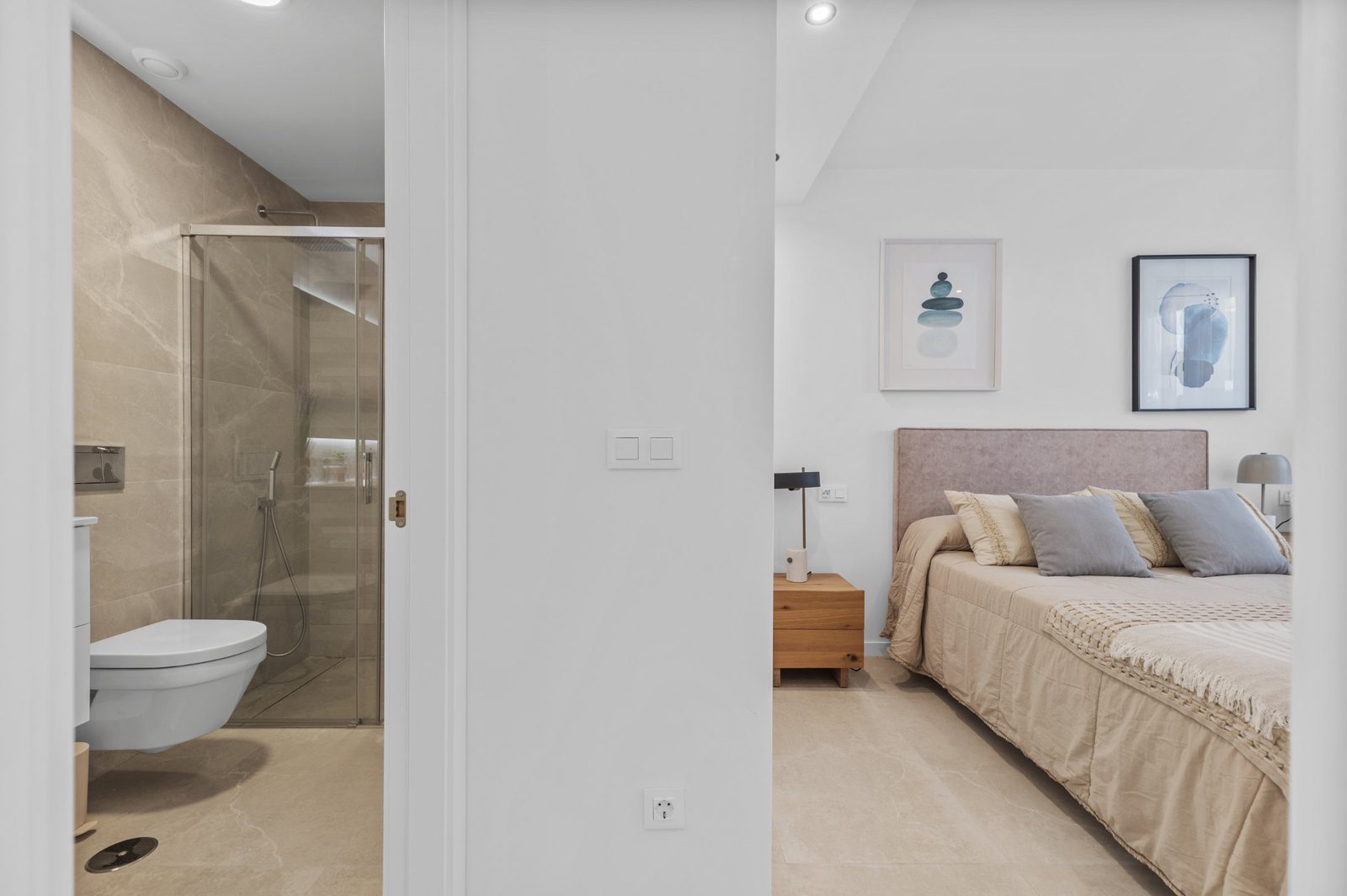 A modern bathroom and bedroom interior of a 2-bedroom apartment in Finestrat - The Estates