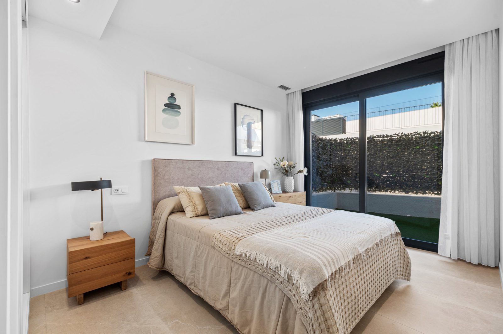 A stylish bedroom with garden views in a 2-bedroom apartment in Finestrat - The Estates