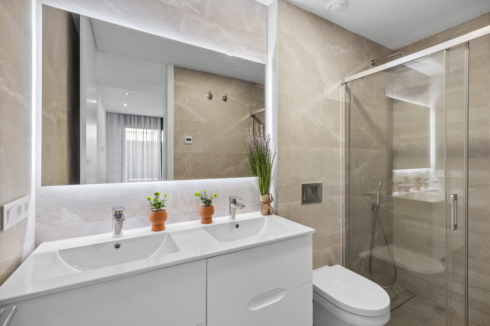 A modern bathroom with a walk-in shower in a 2-bedroom apartment in Finestrat - The Estates