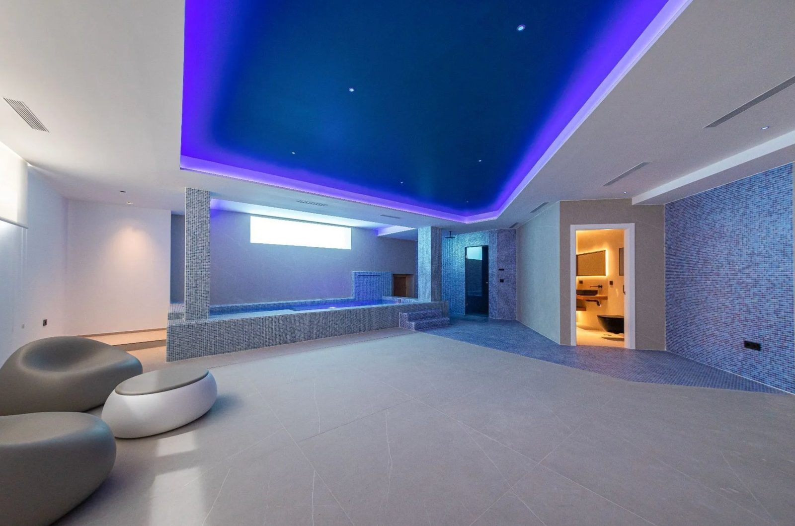 Stylish interior with a blue-lit ceiling and modern design in a 4-bedroom villa in Benidorm - The Estates