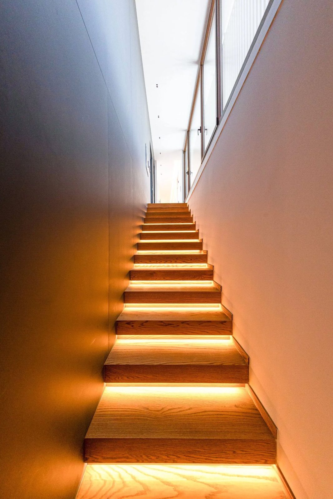 Stylish wooden staircase with integrated lighting in a 4-bedroom villa in Benidorm - The Estates