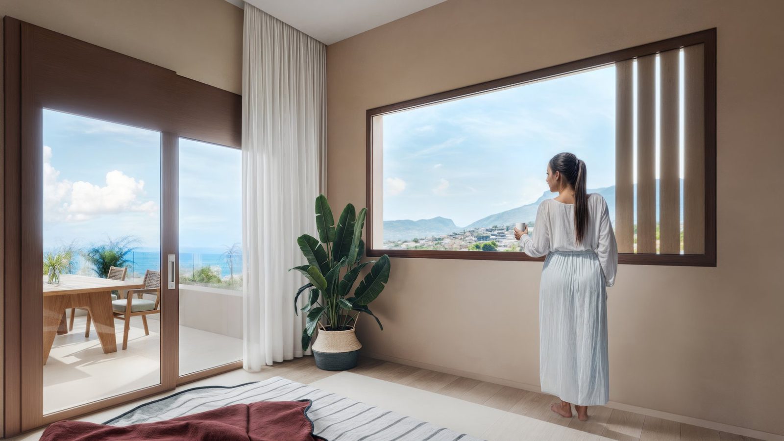 A bright bedroom with mountain and city views from a 3-bedroom villa in Calpe - The Estates