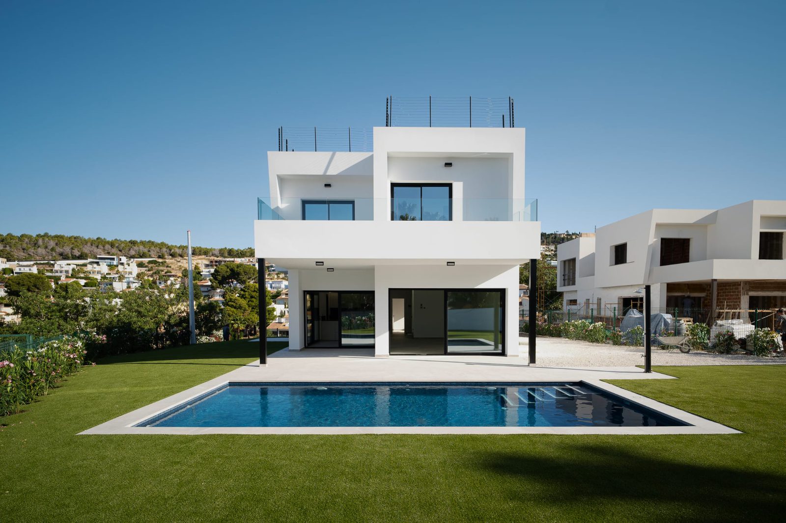 A modern villa with a pool and mountain views in Calpe - The Estates