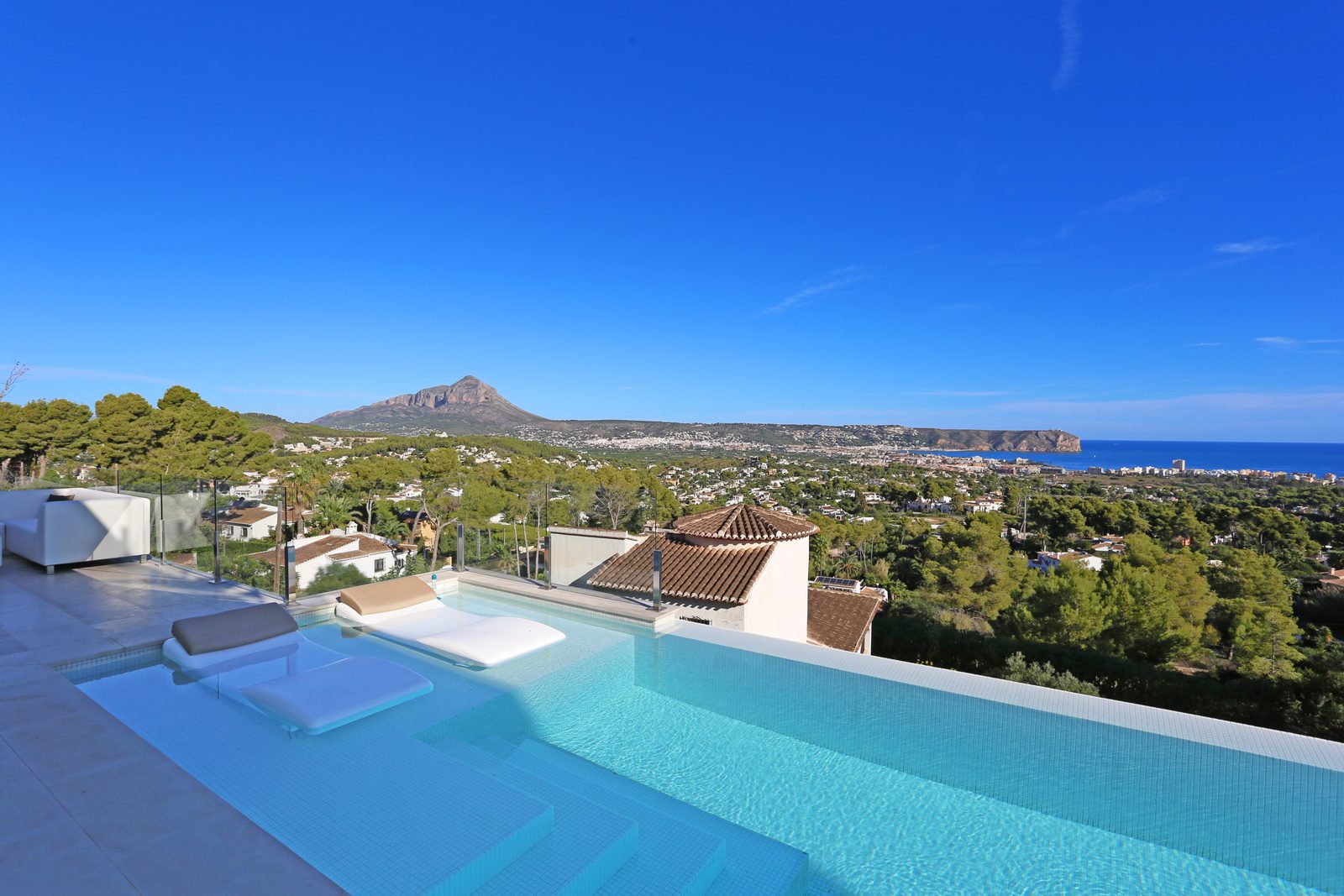 Panoramic sea and mountain views from the pool of a 4-bedroom villa in Javea - The Estates