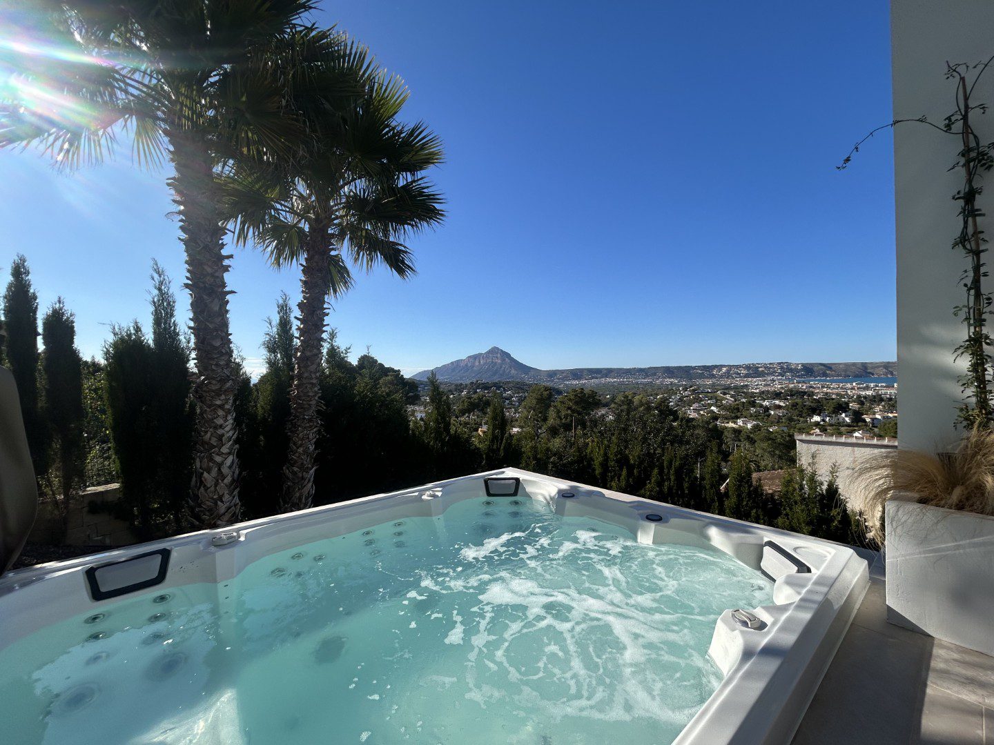 A luxurious jacuzzi with stunning sea and mountain views of a 4-bedroom villa in Javea - The Estates
