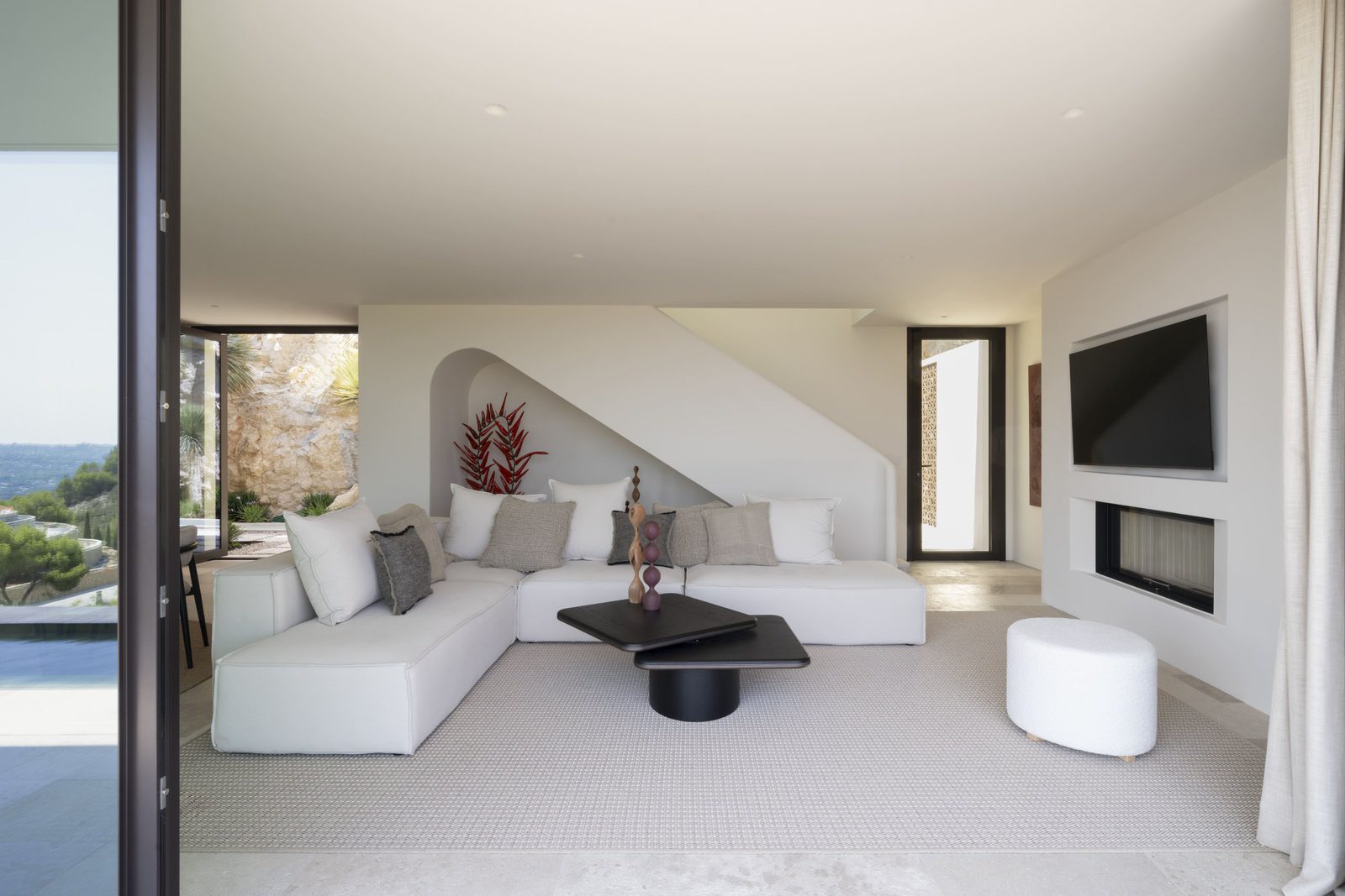 Stylish living room with stunning sea and mountain views inside a 5-bedroom villa in Javea - The Estates