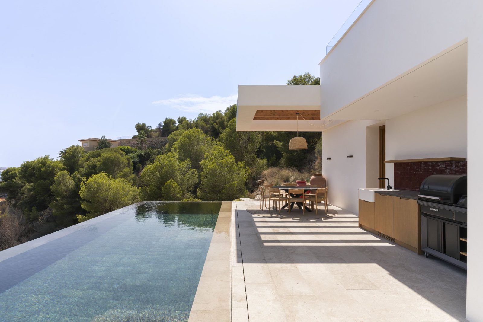 Outdoor kitchen and pool area of a 5-bedroom villa in Javea - The Estates