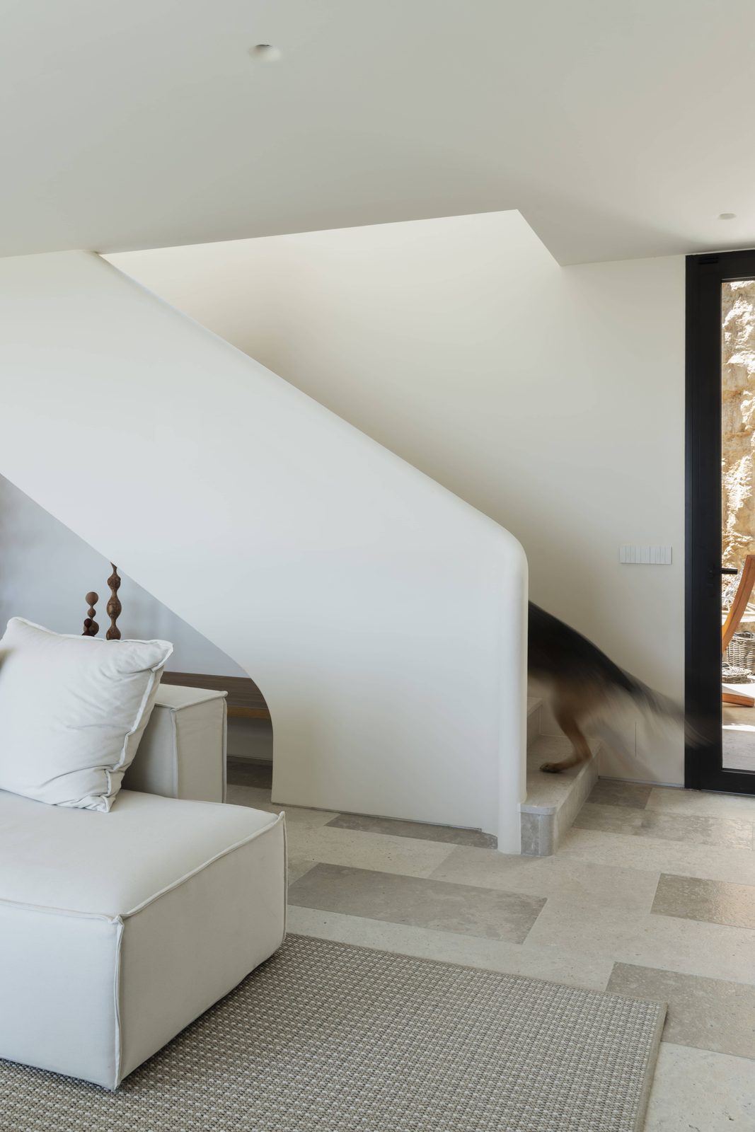 Stylish interior with a curved staircase and modern furnishings in a 5-bedroom villa in Javea - The Estates