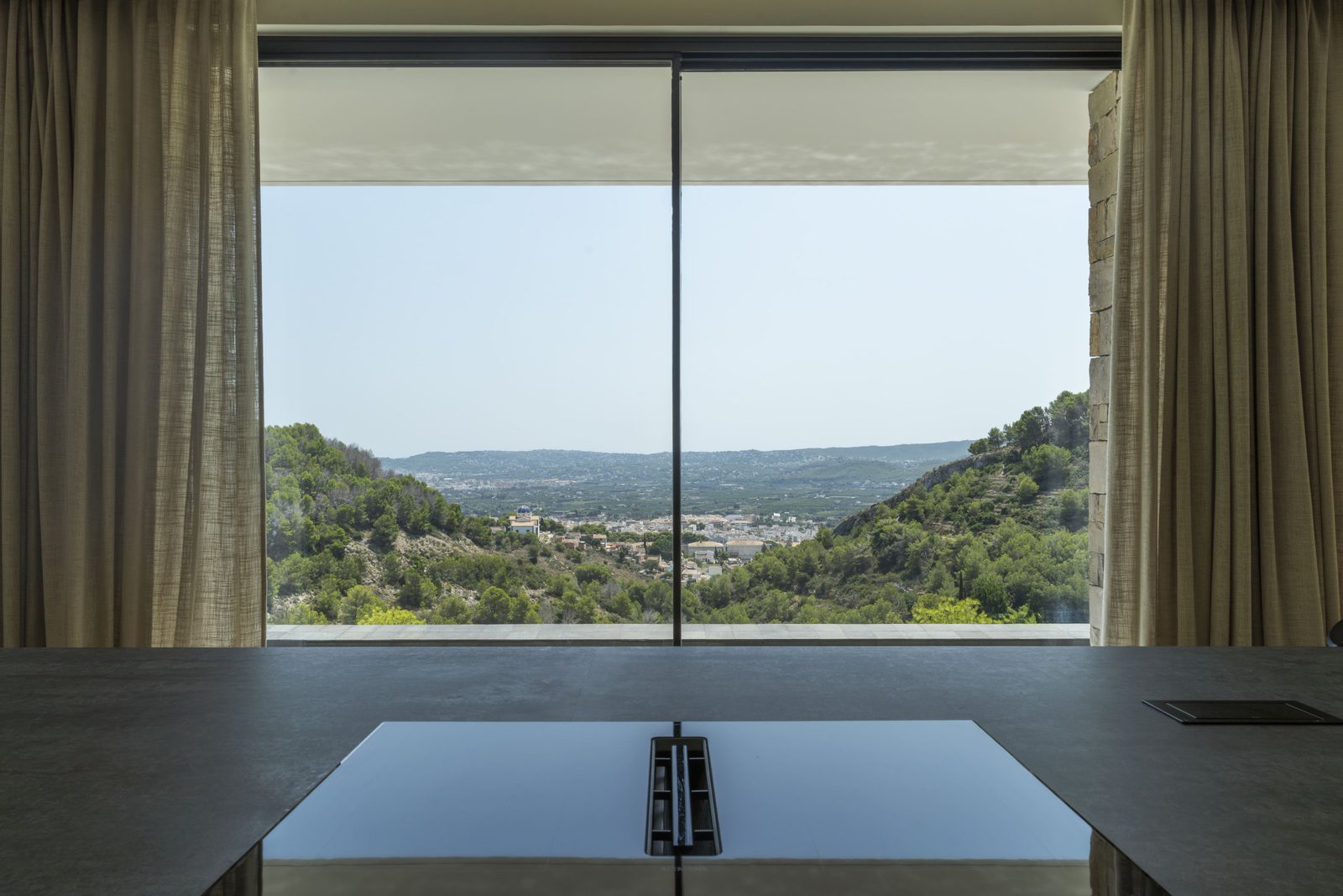 Stunning mountain and countryside views through floor-to-ceiling windows of a 5-bedroom villa in Javea - The Estates