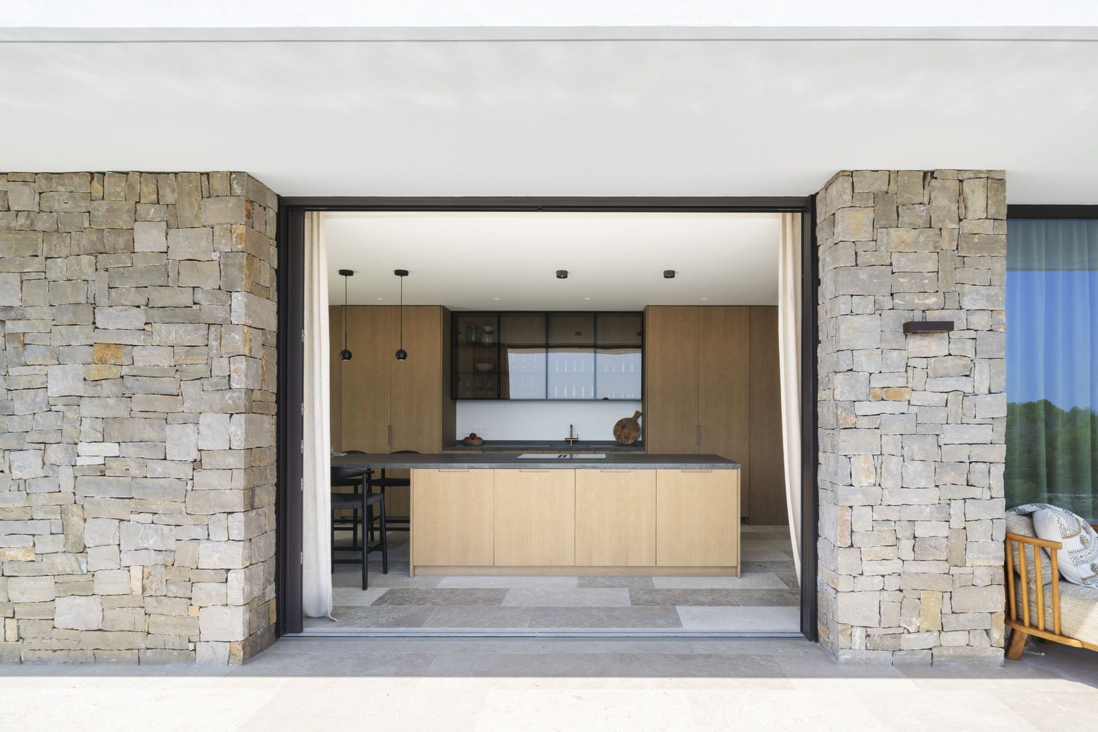Modern kitchen with island view of a 5-bedroom villa in Javea - The Estates