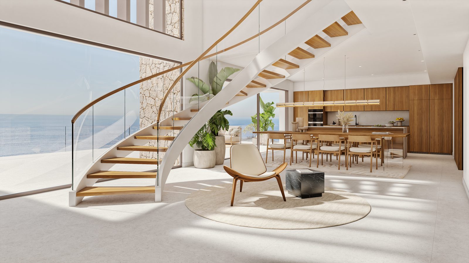 Modern living and dining area with curved staircase and sea views in a 4-bedroom villa in Benitachell - The Estates